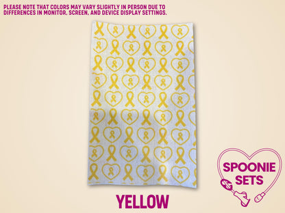 Yellow awareness ribbon tubie tape sheet, sublimation-printed Hypafix for medical device personalization.