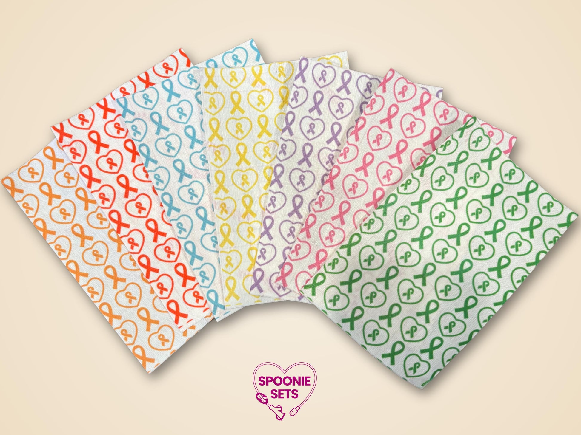 Multicolor awareness ribbon tubie tape sheets with heart designs, made from soft Hypafix tape.