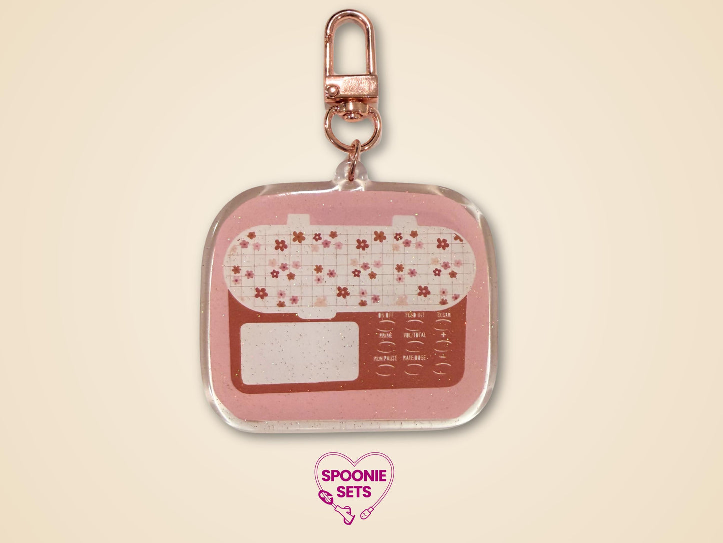 Keychain with feeding tube pump and rose gold hardware