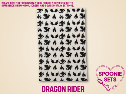 White Hypafix tubie tape with black dragon and flame designs for medical devices.
