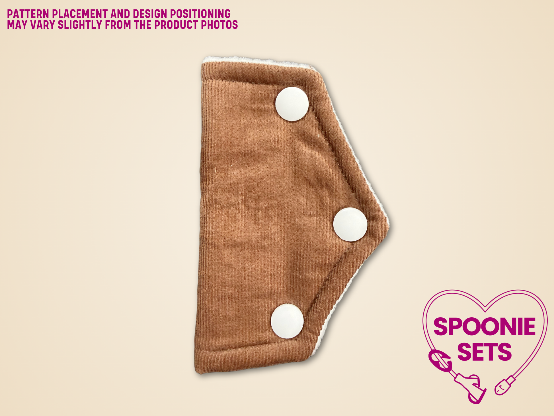 Brown fabric product with white circular snaps on a beige background, featuring 'Spoonie Sets' logo.