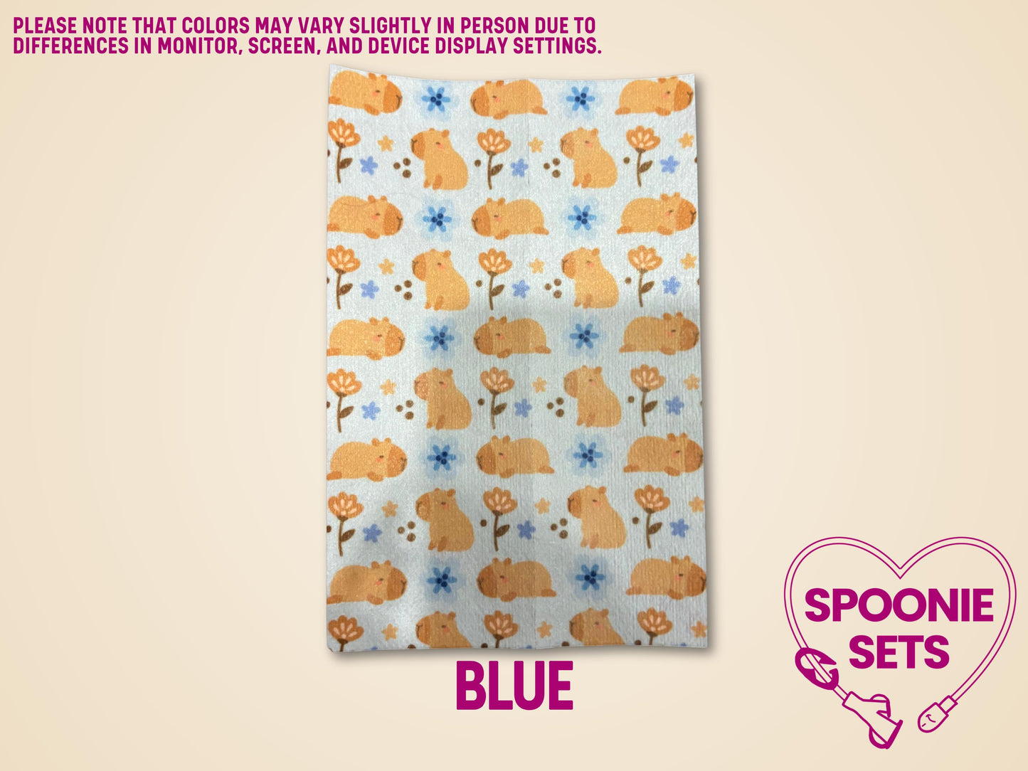 Capybara tubie tape sheet with orange capybaras and blue flowers on white Hypafix tape.