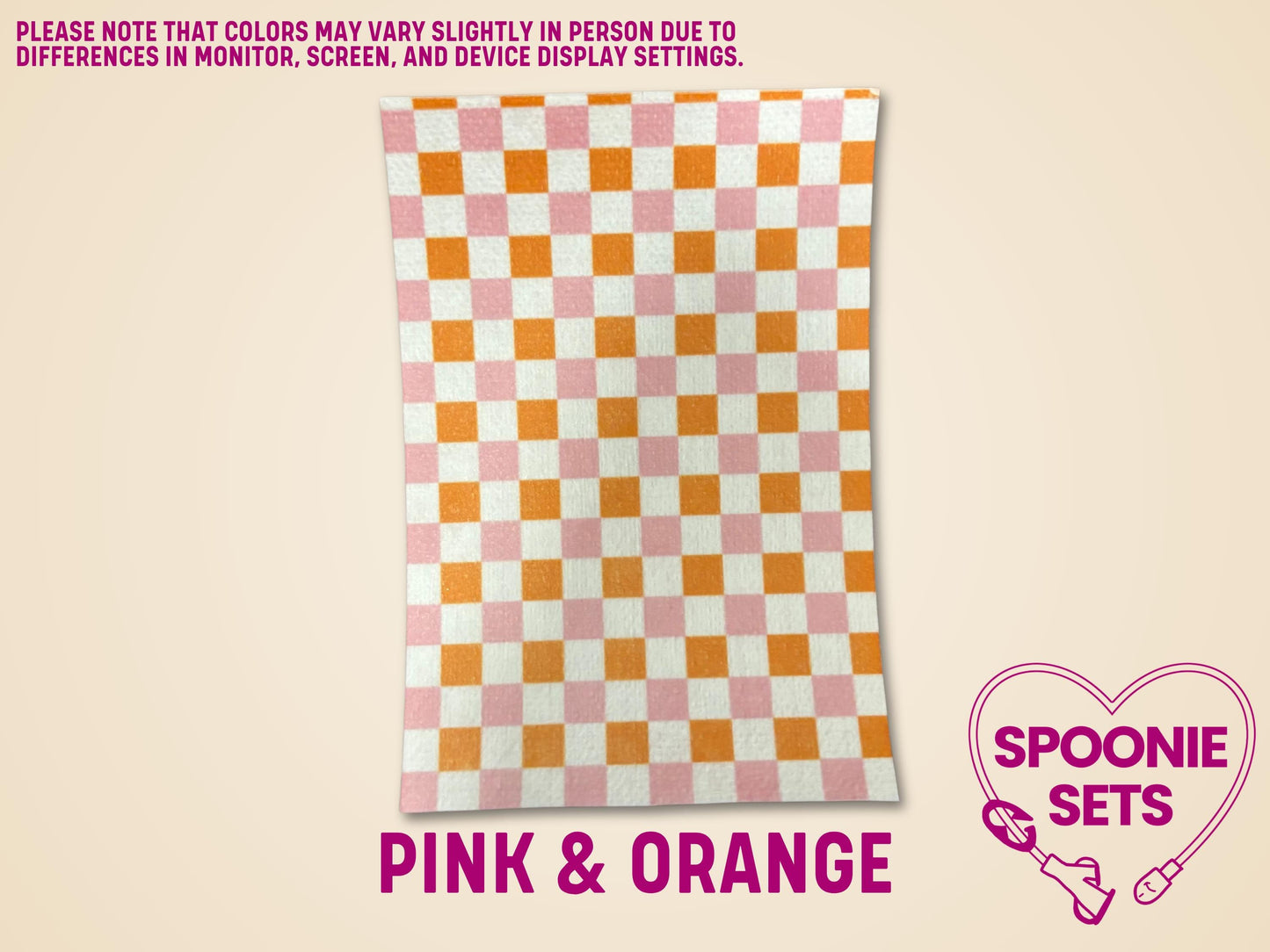 Pink and orange checkered tubie tape sheet made from soft, flexible Hypafix material.