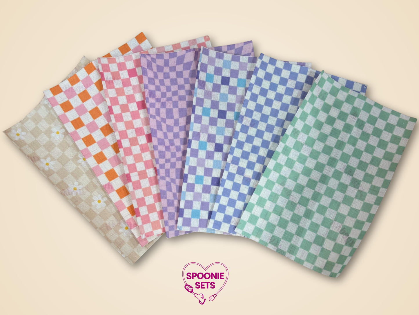 Checkered tubie tape sheets in pink, purple, green, blue, beige, and orange, plus a daisy pattern.