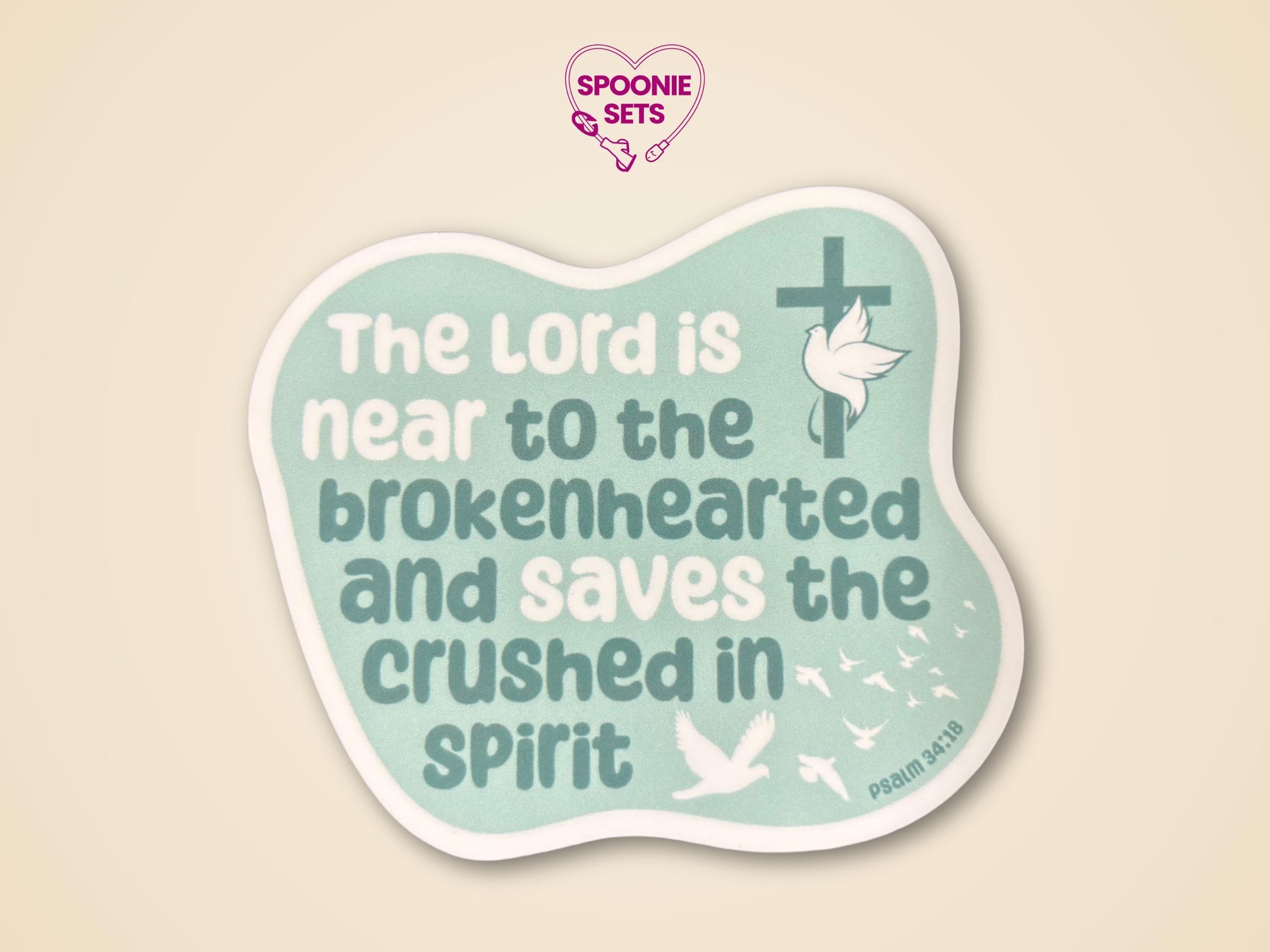 Green Christian sticker with doves, a cross, and Psalm 34:18: "The Lord is near to the brokenhearted...