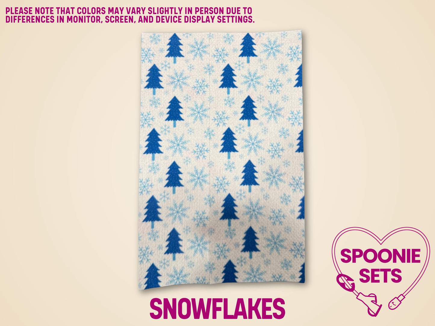 Festive Christmas tubie tape with blue evergreen trees and light blue snowflakes on white Hypafix.