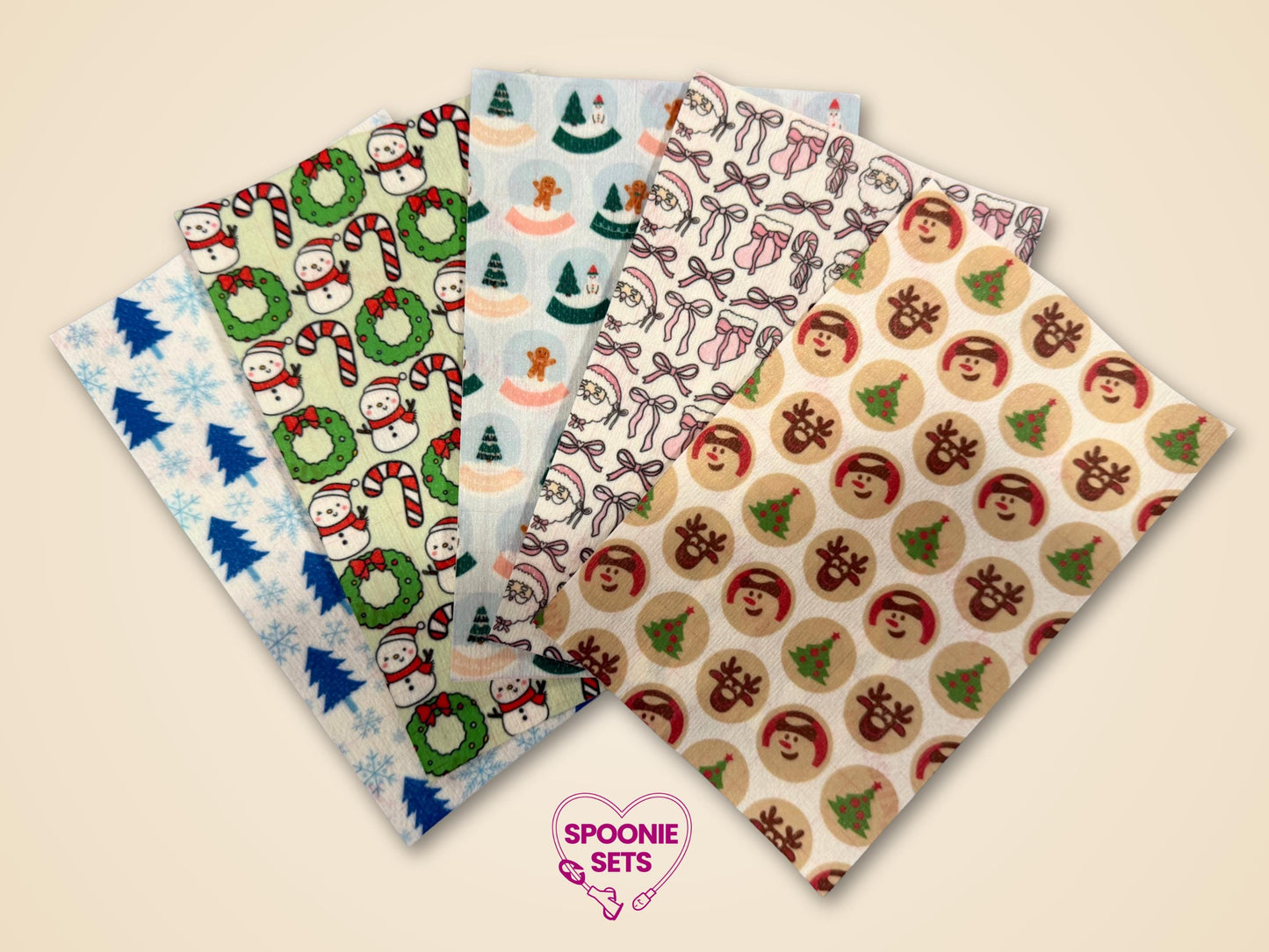 Five festive Christmas tubie tape sheets with snowmen, gingerbread, Santa, reindeer, and tree designs.