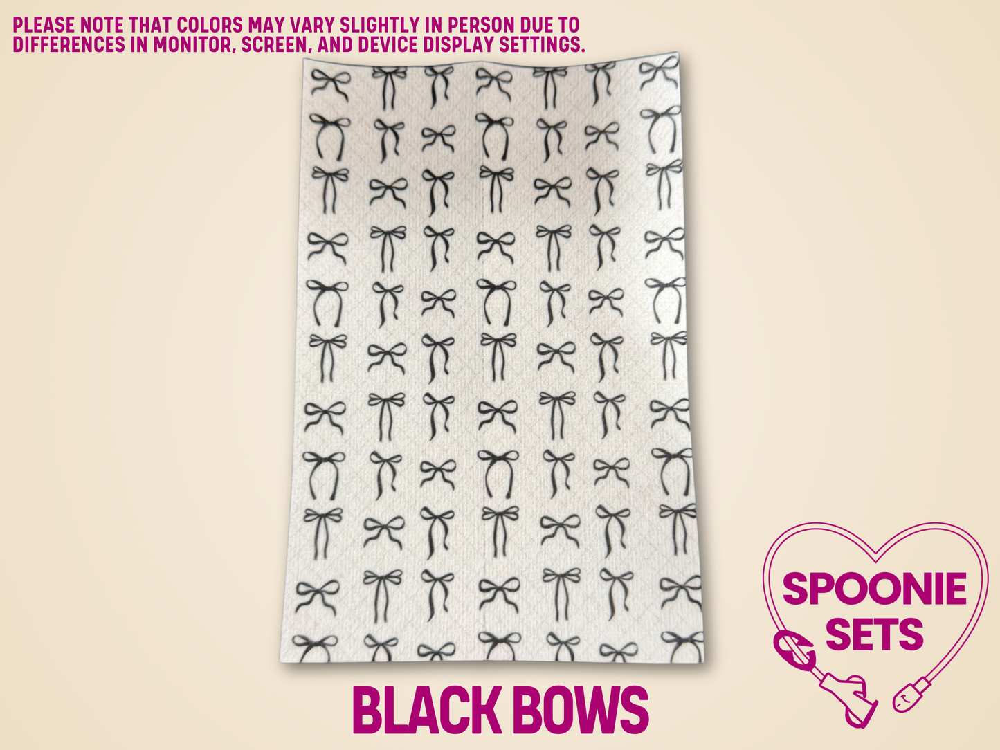 White Hypafix tubie tape sheet with a pattern of small black bows.