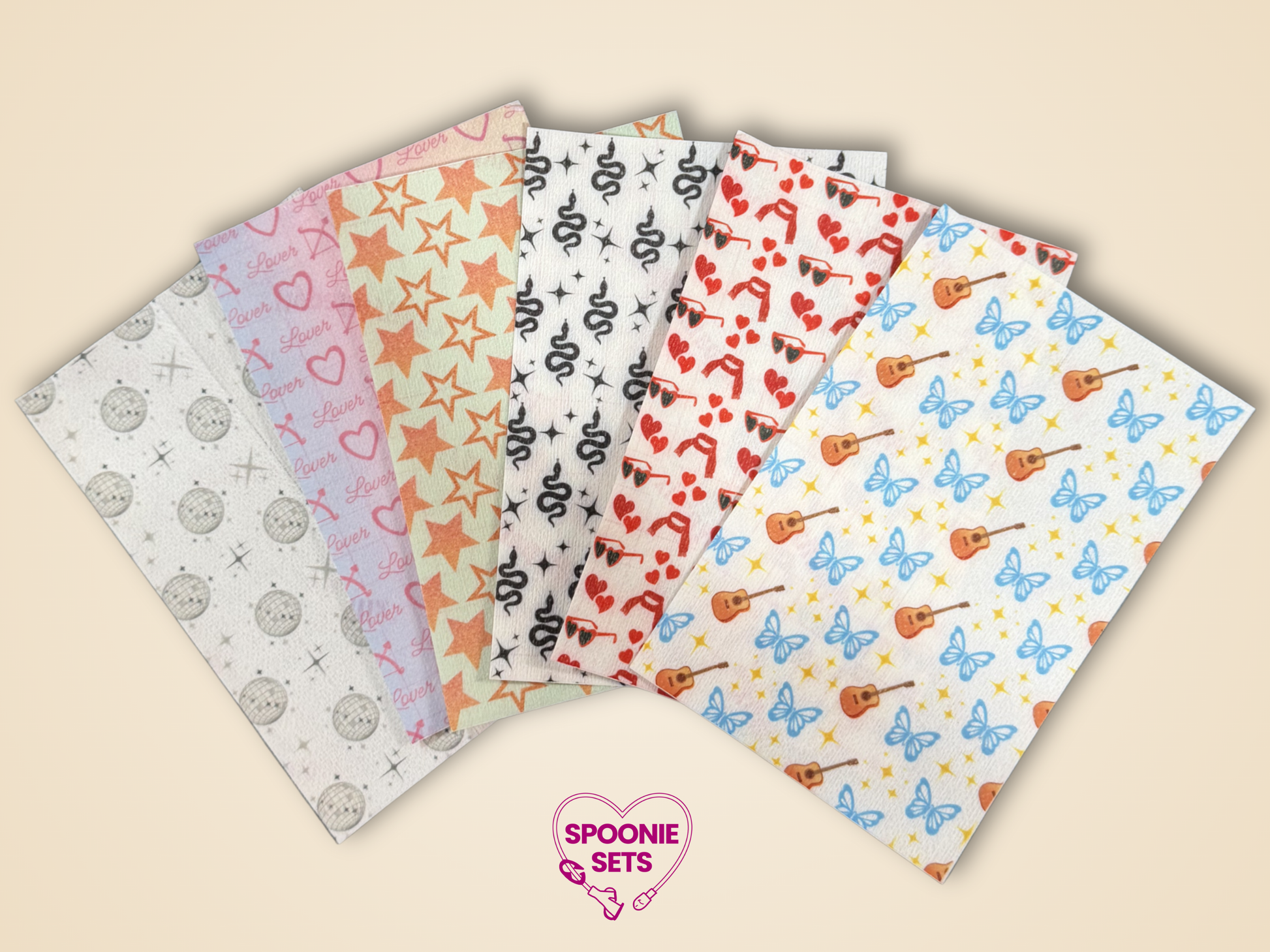 Tubie tape sheets with snake, guitar, heart, and "Lover" album designs.