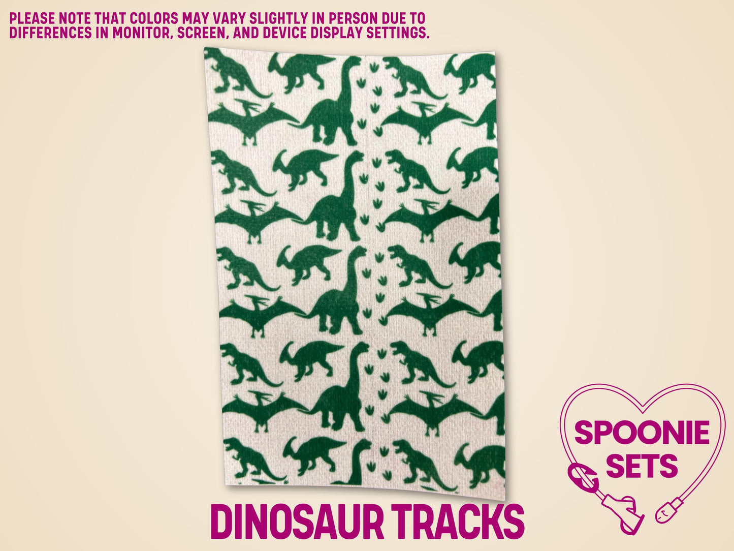 Green dinosaur silhouettes on a white Hypafix tubie tape sheet, featuring various dinosaur tracks.