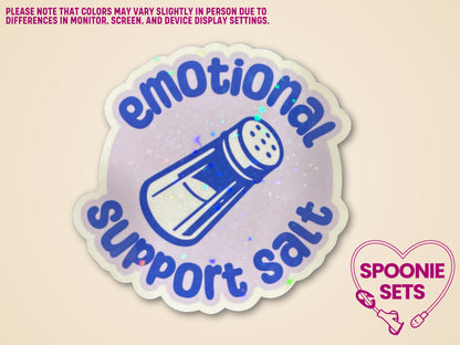 Holographic glitter sticker with a blue salt shaker and "Emotional Support Salt" text, 3" wide x 3" tall.