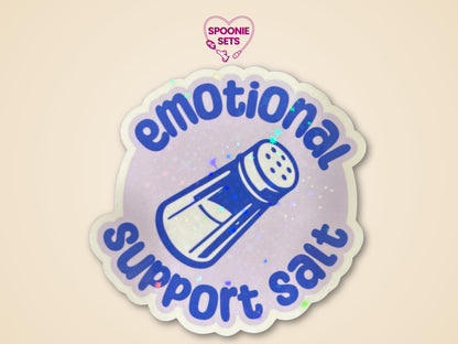 Holographic glitter sticker with a blue salt shaker and "Emotional Support Salt" text on a light purple background.