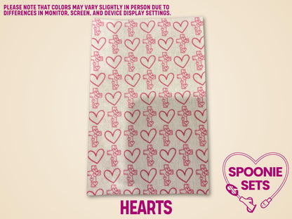 White Hypafix tubie tape sheet with repeating pink outline hearts and crosses pattern.