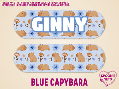 Matte blue feeding tube pump sticker with capybara and flower pattern, one personalized with "GINNY".