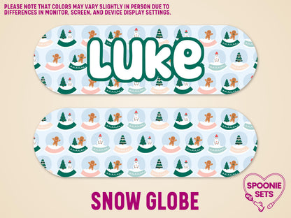 Personalized Infinity pump sticker with "Luke" in green, featuring snowmen, gingerbread, and trees in snow globes.