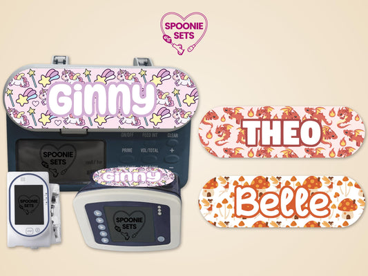 Fantasy feeding tube pump stickers: pink unicorn "Ginny," red dragon "Theo," and mushroom "Belle" designs.