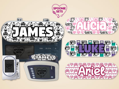 Video game-themed feeding tube pump stickers: "JAMES" with 16-bit mushrooms, "Alicia" with pixel cats, "Luke" with "LEVEL UP" blocks, and "Ariel" with pink hearts and controllers.