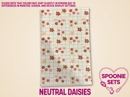 White Hypafix tubie tape sheet with a neutral grid pattern and scattered pink, orange, and brown daisy flowers.