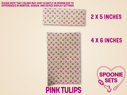 Two sheets of pink tulip floral tubie tape, 2x5 and 4x6 inches, made from Hypafix tape.