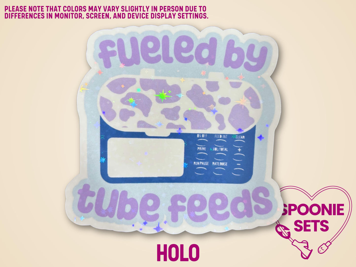 Holographic "Fueled by Tube Feeds" sticker with a purple cow-print feeding tube pump on a light blue background.