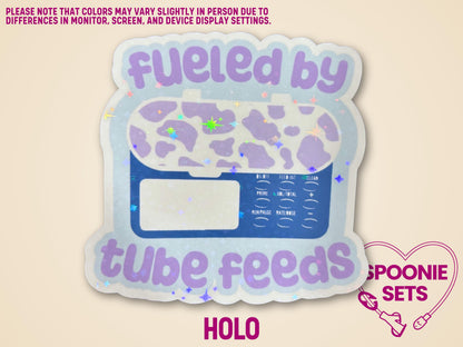 Holographic "Fueled by Tube Feeds" sticker with a purple cow-print feeding tube pump on a light blue background.
