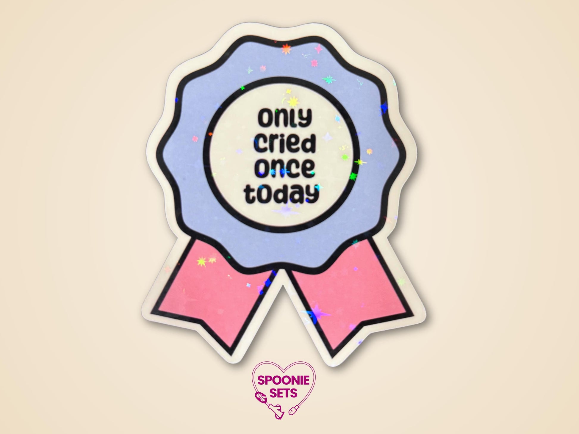Blue and pink award ribbon sticker with "Only Cried Once Today" text and holographic glitter laminate.