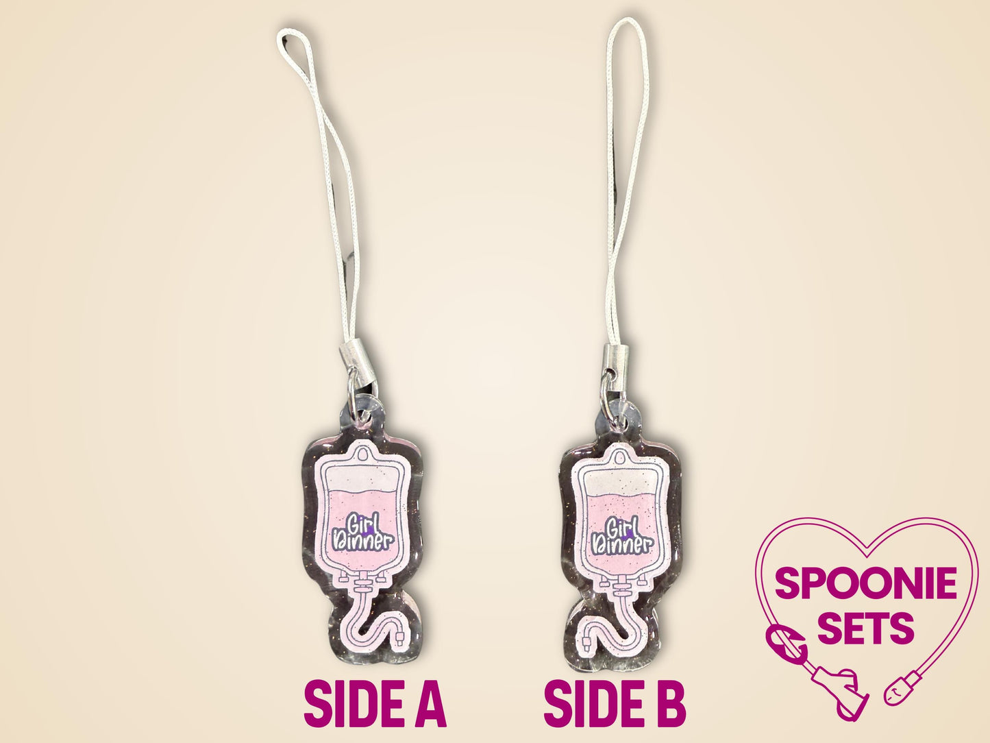Pink TPN bag acrylic keychain with "Girl Dinner" text, glitter epoxy finish, and white strap.