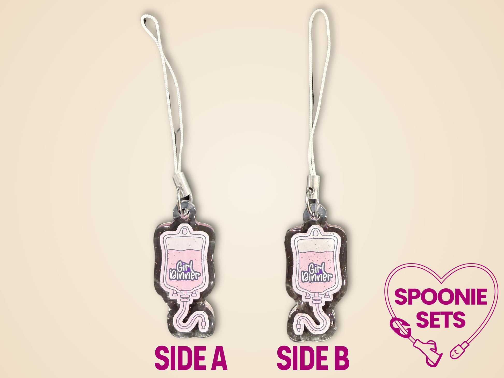 Pink TPN bag acrylic keychain with "Girl Dinner" text, glitter epoxy finish, and white strap.