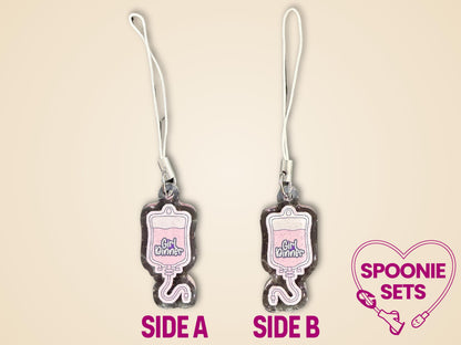 Pink TPN bag acrylic keychain with "Girl Dinner" text, glitter epoxy finish, and white strap.