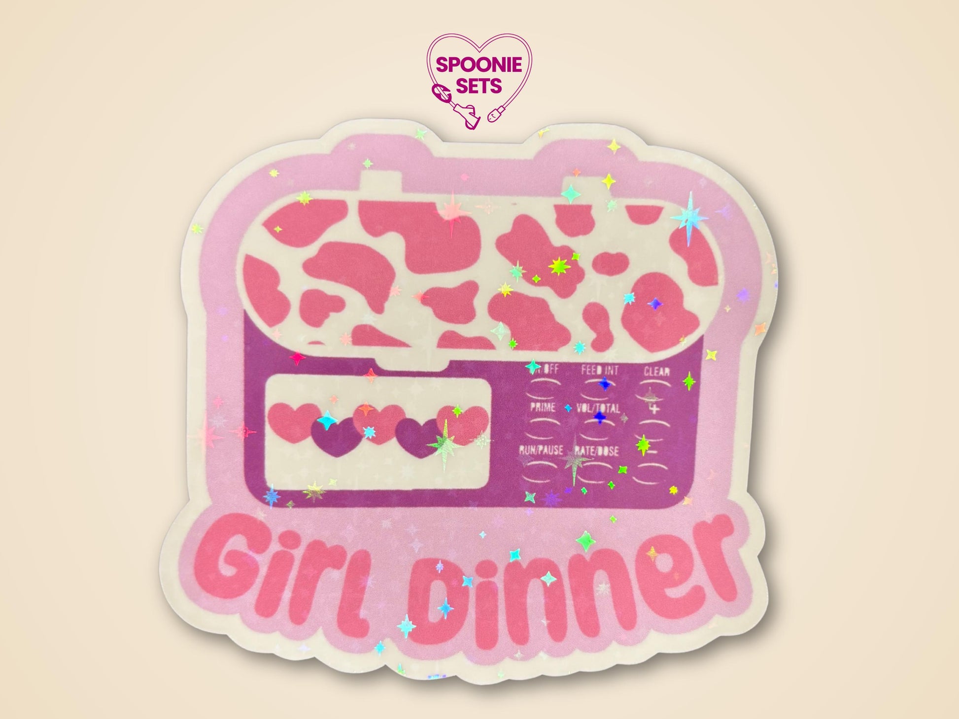 Holographic glitter sticker of a pink feeding tube pump with a cow print and "Girl Dinner" text.