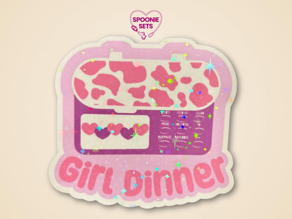 Holographic glitter sticker of a pink feeding tube pump with a cow print and "Girl Dinner" text.