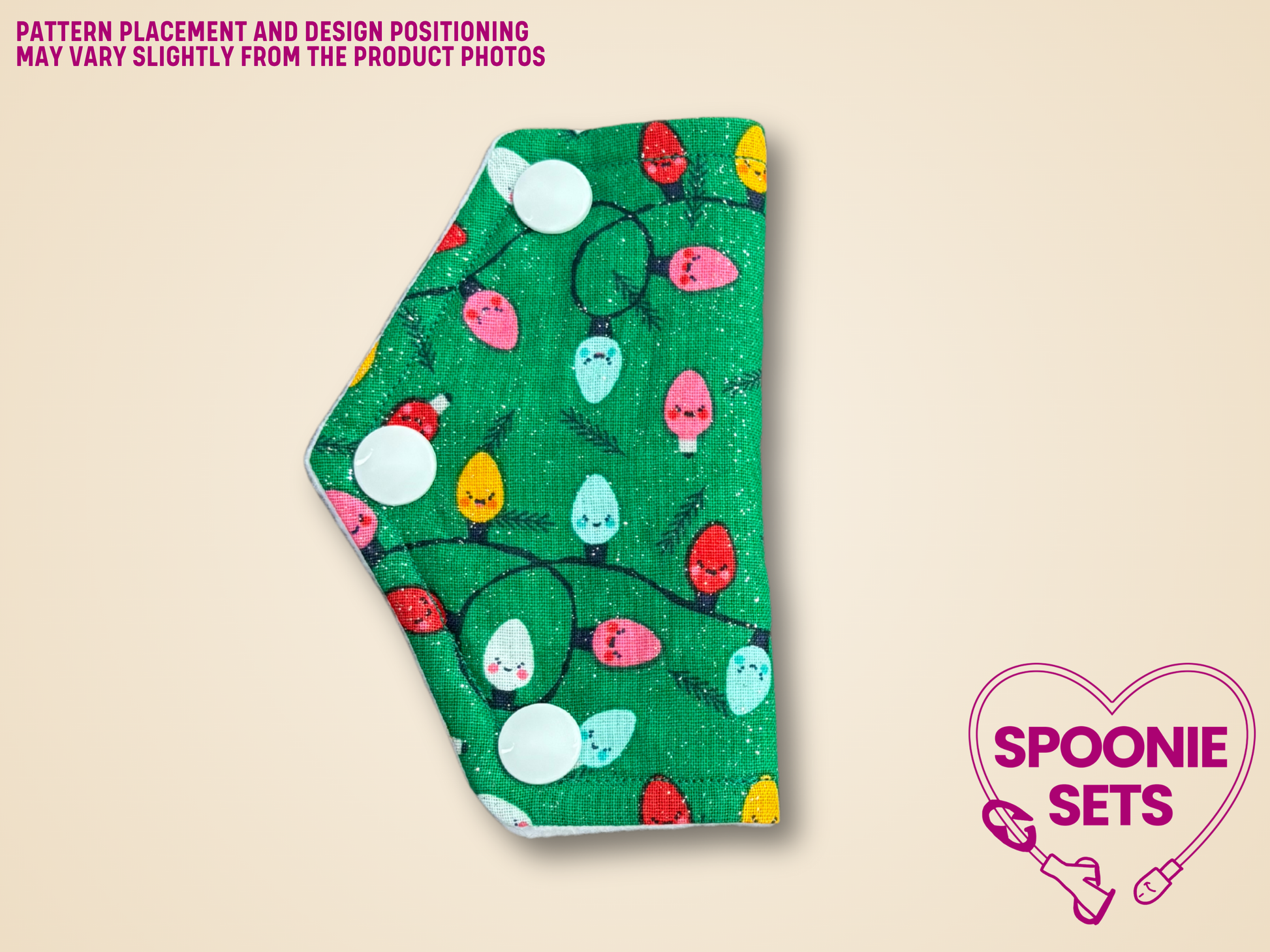 port cover with Christmas lights design on a beige background, featuring the brand 'Spoonie Sets'.