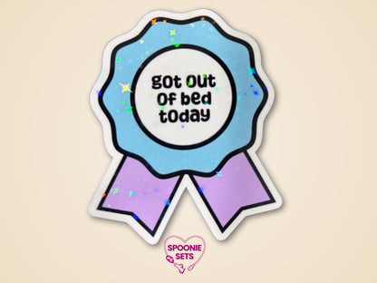 Holographic glitter award ribbon sticker with blue and purple hues, reading "got out of bed today.