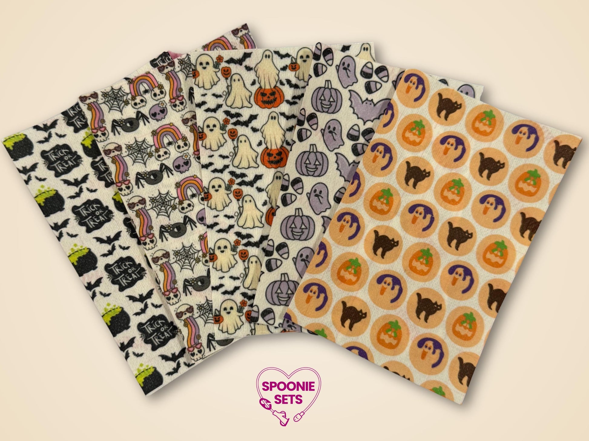Halloween tubie tape sheets with cookies, pumpkins, ghosts, potions, bats, and black cats on Hypafix tape.