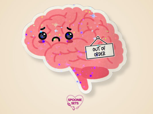Pink brain sticker with a frowning face and an "Out of Order" sign, featuring a holographic glitter laminate finish.