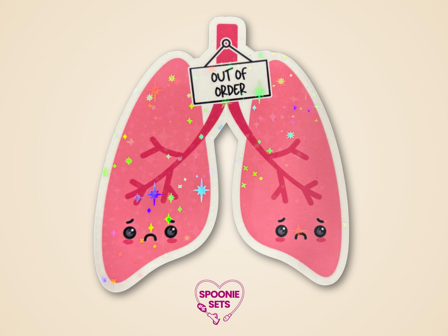Holographic glitter sticker of pink lungs with sad faces and an "Out of Order" sign.
