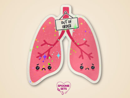 Holographic glitter sticker of pink lungs with sad faces and an "Out of Order" sign.