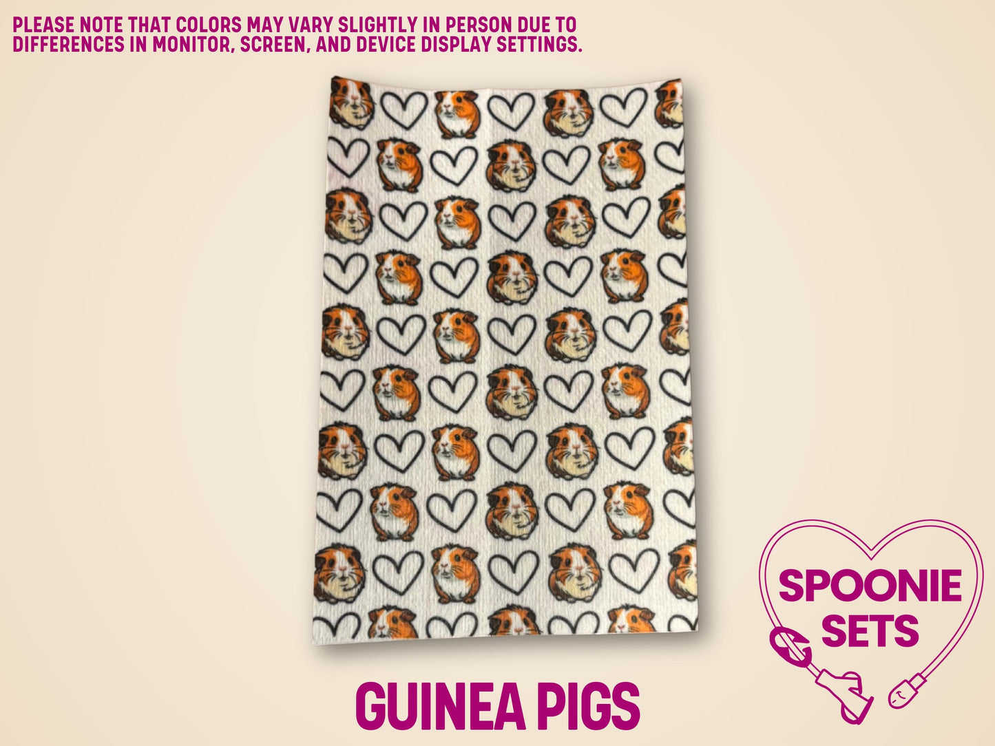 White Hypafix tubie tape with a repeating pattern of guinea pig faces and black outline hearts.