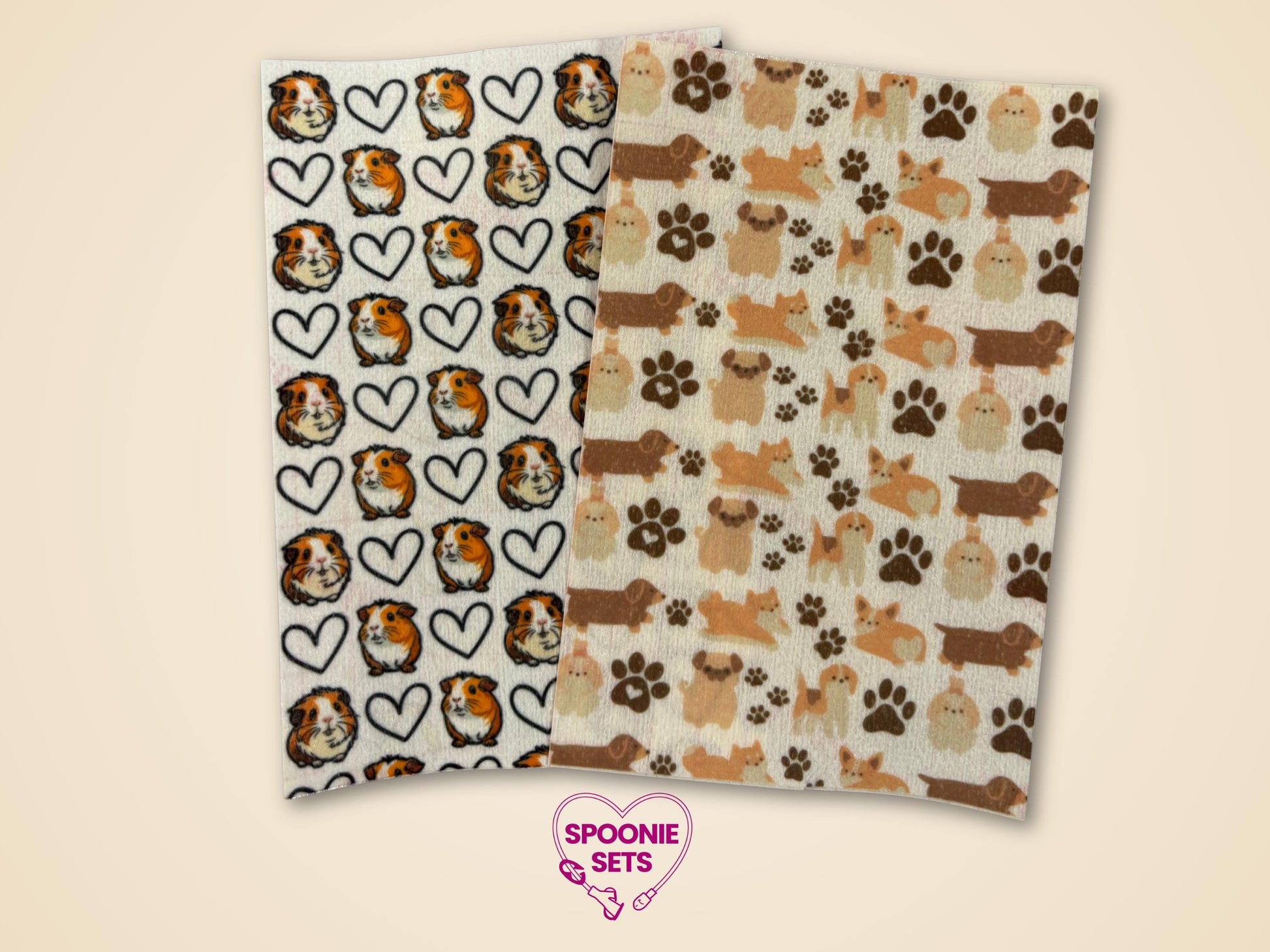 Two sheets of Hypafix tubie tape: one with guinea pigs and hearts, the other with dogs and paw prints.