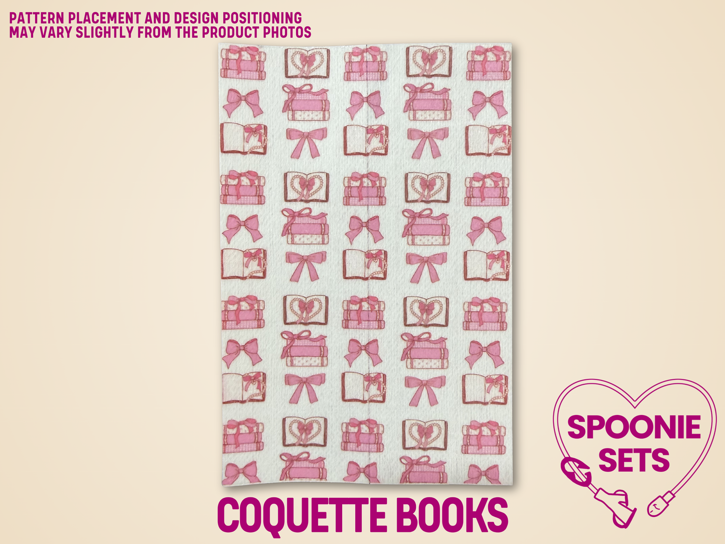White Hypafix tubie tape with rows of pink bows, open books, and stacked books.