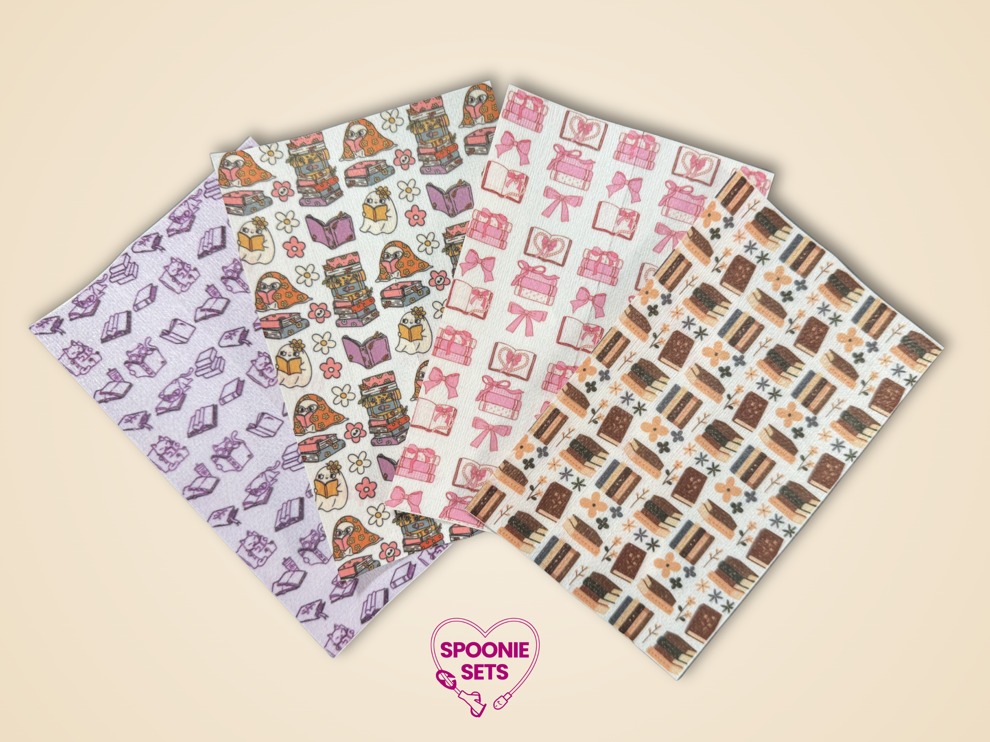Four sheets of Hypafix tubie tape: pink bows, floral library with cats, and brown book stacks.
