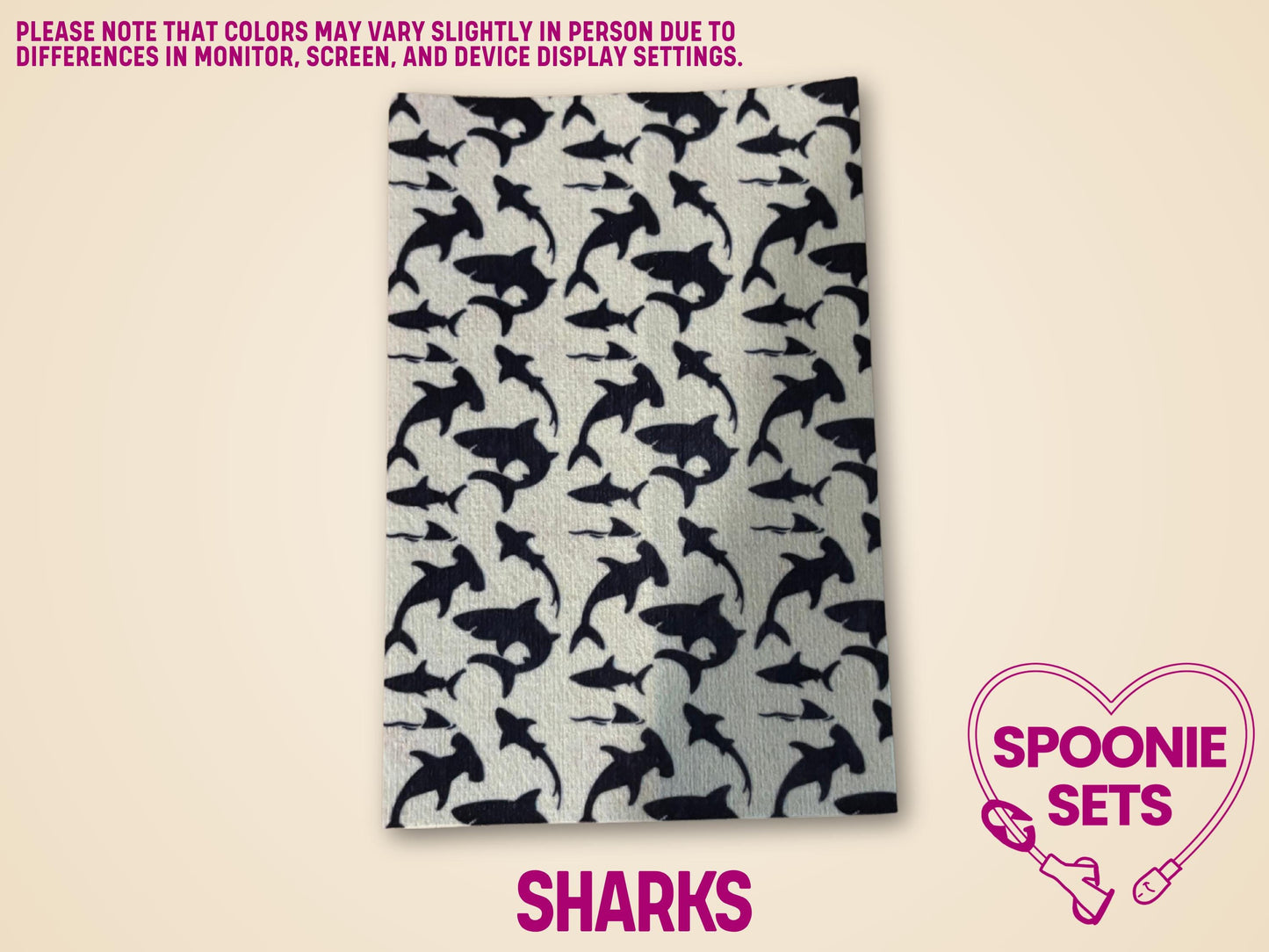 White Hypafix tubie tape sheet with a repeating pattern of black shark silhouettes.