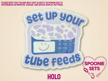 Holographic sticker with a purple feeding tube pump and "set up your tube feeds" text.
