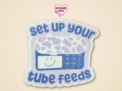 Holographic glitter sticker of a purple feeding tube pump with "Set Up Your Tube Feeds" text.