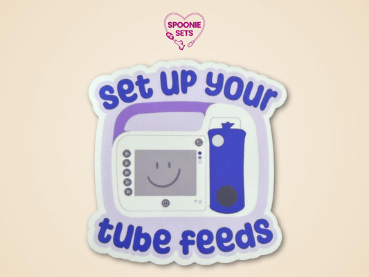 Purple and white "Set Up Your Tube Feeds" sticker with a feeding tube pump design.