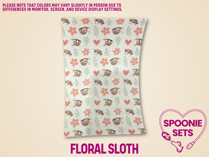 Floral sloth printed Hypafix tubie tape with brown sloths, pink flowers, and green leaves on a white background.