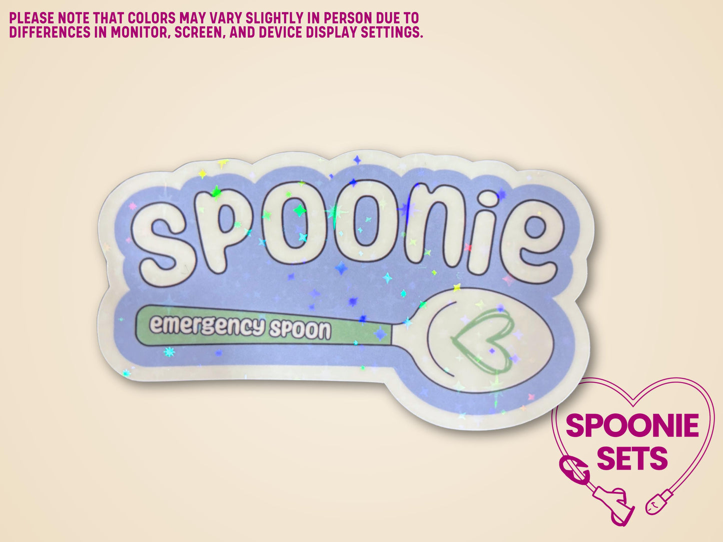 Holographic "Spoonie" sticker with a white and green spoon, "emergency spoon" text, and a heart.