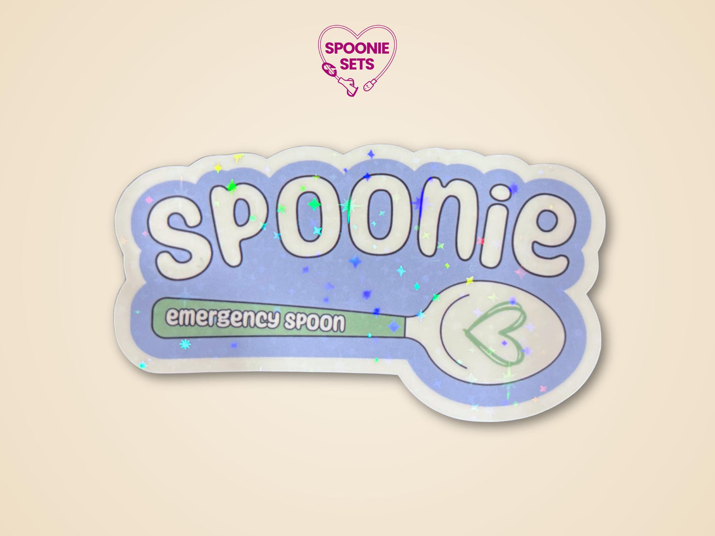 Holographic glitter "Spoonie" sticker with "emergency spoon" text and a green spoon design.