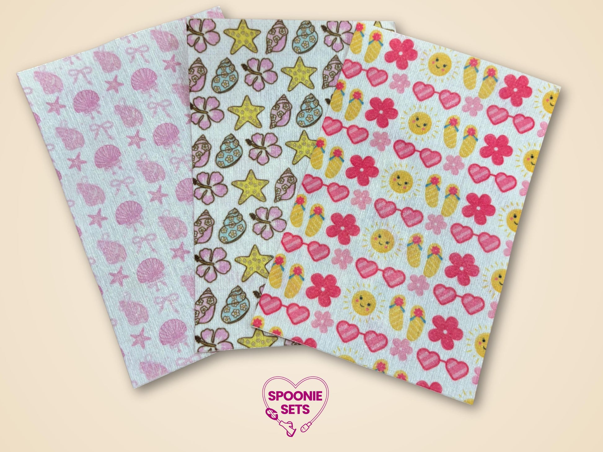 Three sheets of Hypafix tubie tape with summer designs: pink seashells, floral/seashells, and sun/flip-flops.