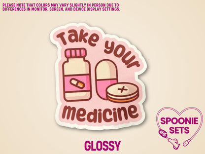Glossy matte sticker with pink pill bottle, pills, and "Take Your Medicine" text on a peach background.
